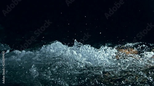 Wallpaper Mural Slow motion of waves on dark water surface with play of flecks of bright light close up. Amazing dramatic natural background. Shooting with 180fps. Epic mystical and magic night view. Crystal clear Torontodigital.ca