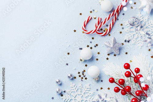 Christmas card or banner. Christmas silver decorations on blue background.