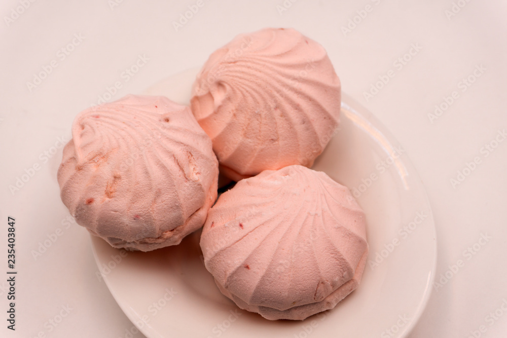 Colorful mini marshmallows isolated on white background, macro. Fluffy marshmallows texture and pattern. High Resolution image . Colorful mini marshmallows isolated on white background, macro. Fluffy marshmallows texture and pattern. High Resolution image .