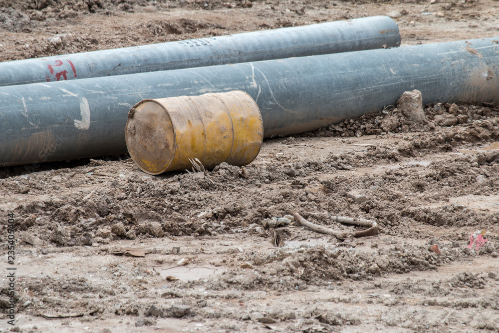 Open construction work site with heavy machinery equipment construction materials Open construction work site with heavy machinery equipment construction materials