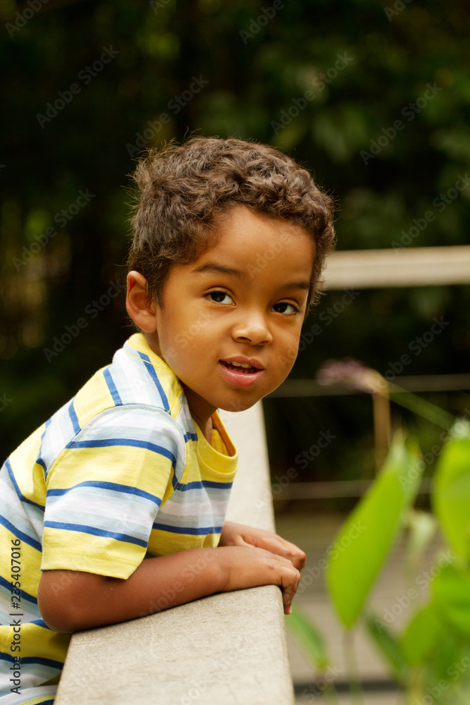 Handsome hispanic boy smiling and outside playing. Handsome hispanic boy smiling and outside playing.