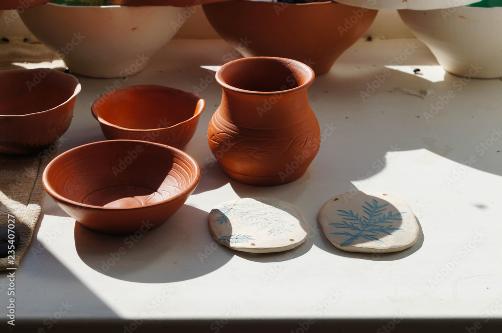 Beautiful bowls and vase in sunlight for drying, Altai,Russia. Beautiful bowls and vase in sunlight for drying, Altai,Russia.
