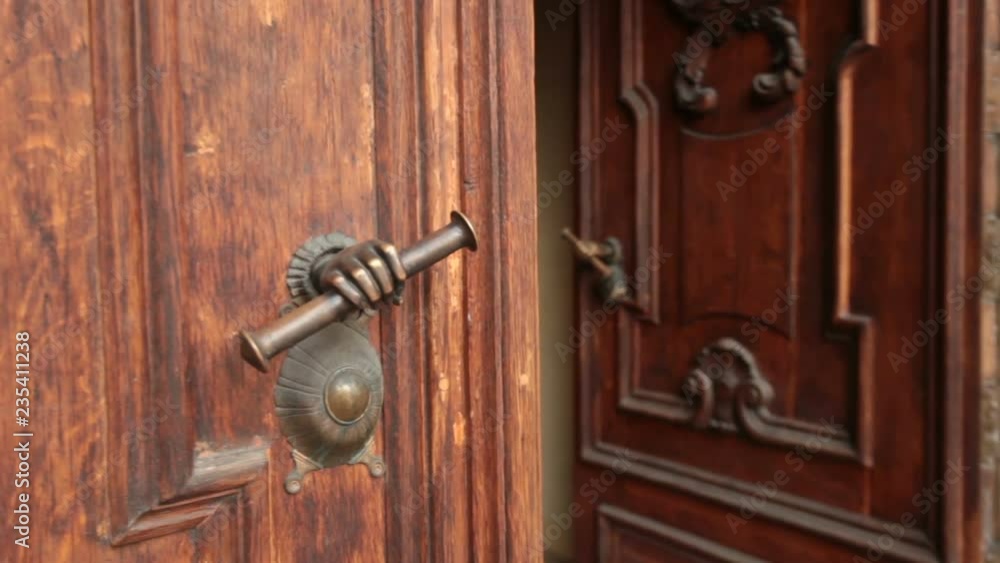 antique doorknob in the form of a hand, massive door open antique doorknob in the form of a hand, massive door open