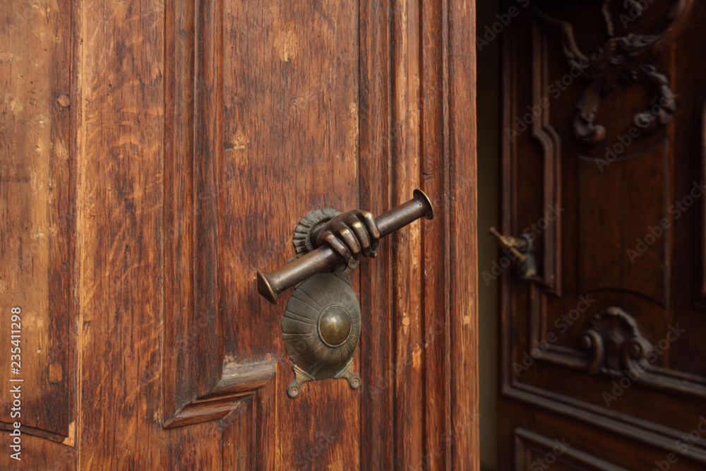 antique doorknob in the form of a hand, massive door open antique doorknob in the form of a hand, massive door open