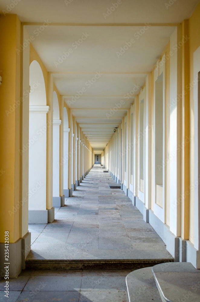 Long corridor with yellow columns