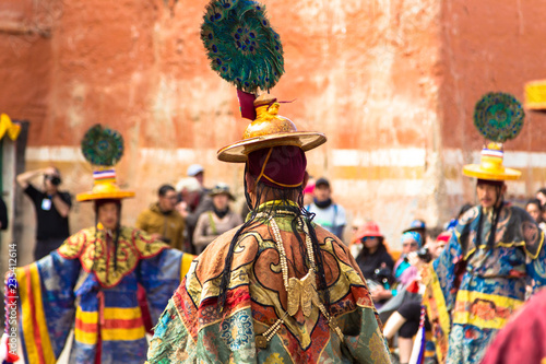 LO-MANTHANG, NEPAL - MAY 12, 2018 : Unidentified monk in mask perform a religious masked mystery dance of Tibetan Buddhism during the Tiji festival in monastery at Lo-Manthang, Nepal.