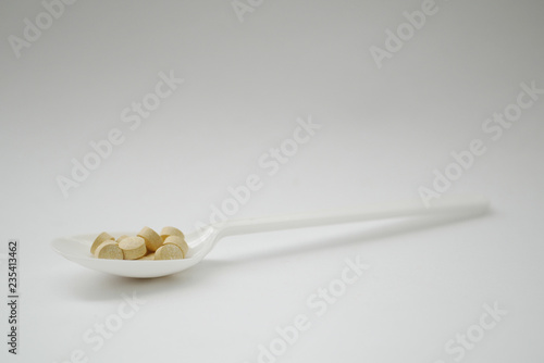 spoon with pills