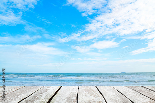 empty wood desk and summer blue sea background .Blank space for text and images.Concept Summer  Beach  Sea  Relax  Party.