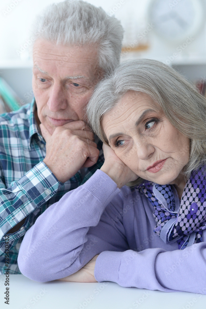 Close up portrait of sad senior couple posing Close up portrait of sad senior couple posing
