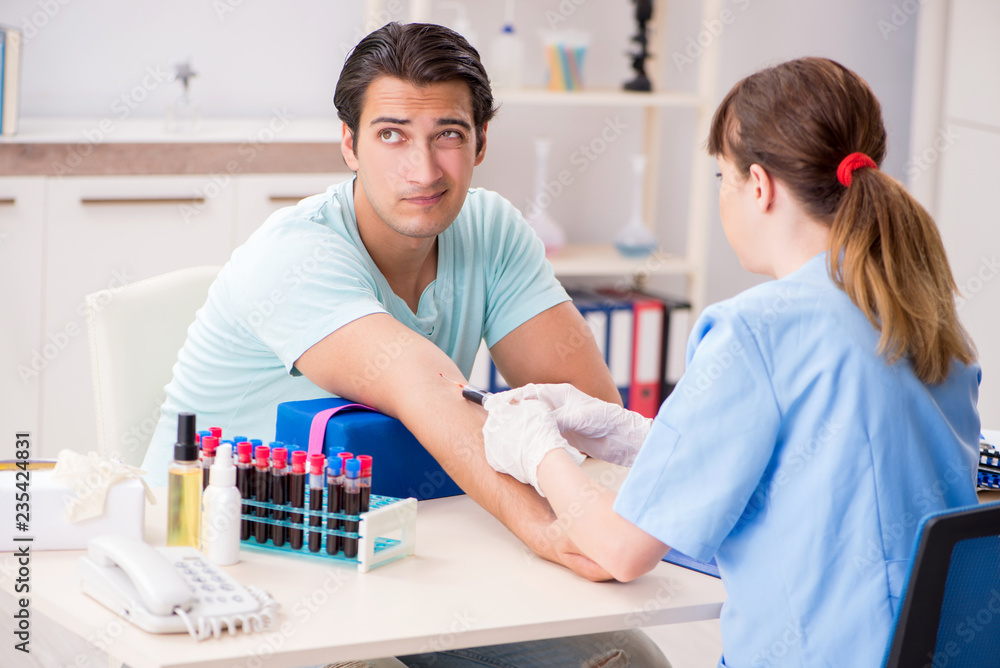 Young patient during blood test sampling procedure Young patient during blood test sampling procedure