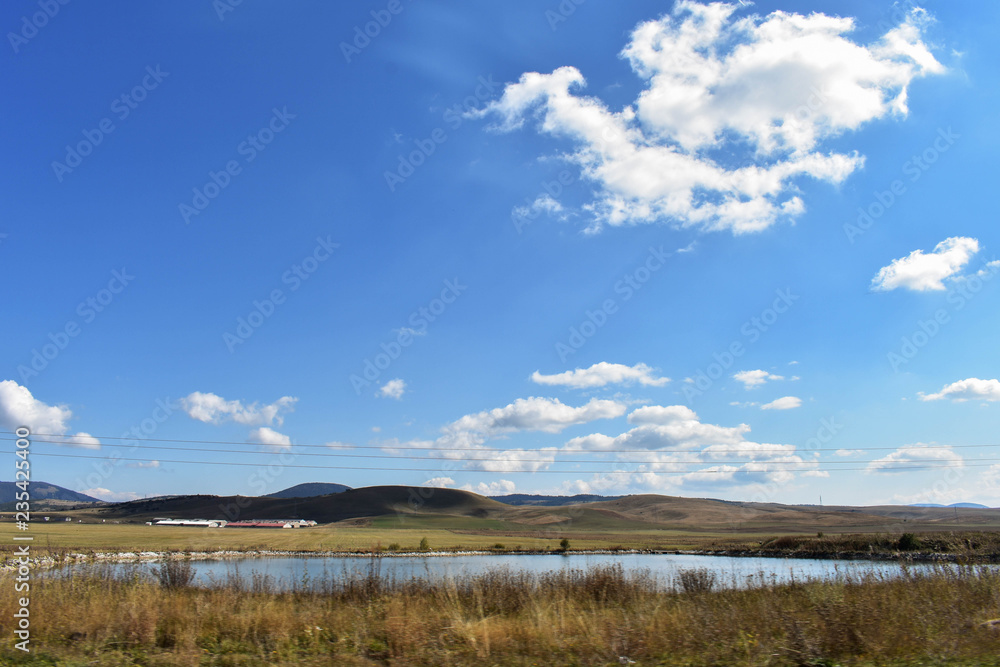 Obraz premium Green forests, river and mountains under blue sky/ landscape nature photography
