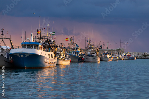 A fishing harbour on the Costa del Sol in Spain at sunset in winter