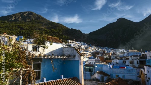 Chefchaouen, Morocco - November 2018: 4K timelapse of famous Medina blue old city Chefchaouen, Morocco on dawn. The rays of the sun illuminates the blue city.