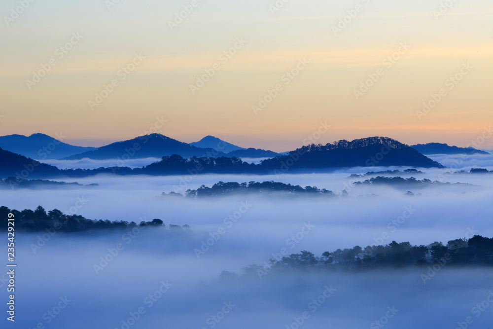 Misty mountain layer at dawn