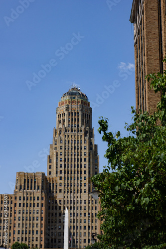 Buffalo City hall and Niagara Square ( State of New York) view from court Street during day time from the middle of the road. Blue sky with almost no clouds and no cars driving by.