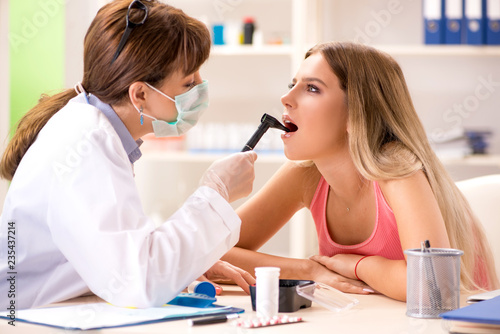 Young beautiful woman visiting female dentist 