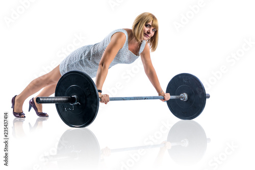 Businesswoman is exersising with heavy barbell. Isolated on white photo for business financial strength concept.