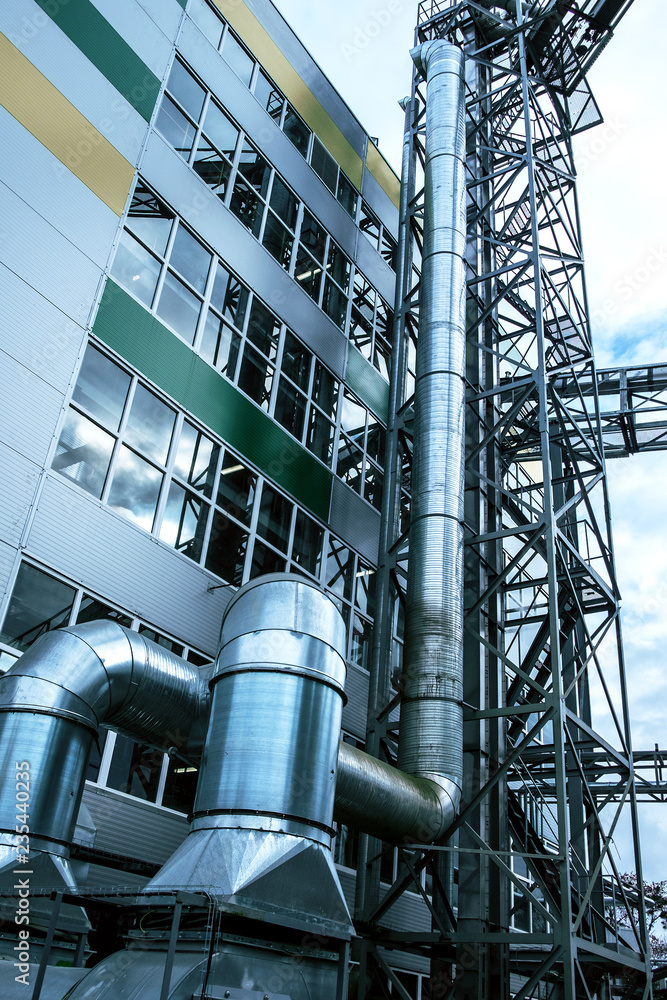 Φωτογραφία Close up view of the modern industrial building exterior with huge diameter ventilation pipes on the facade