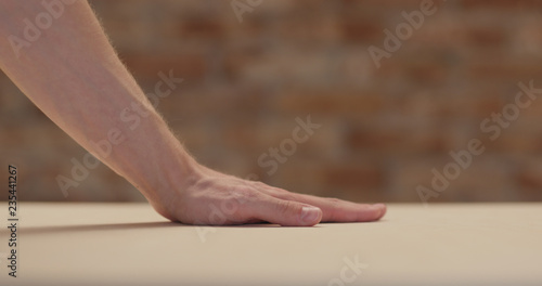 Wallpaper Mural closeup man hand touches plywood to check surface Torontodigital.ca