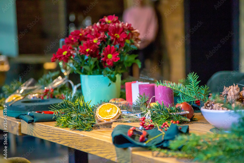 Table with accessories for making by hand a unique magic Christmas wreath, background