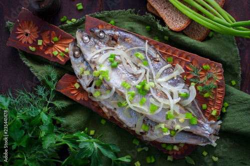 Fish Ryapushka stew with onions, top view, horizontal photo