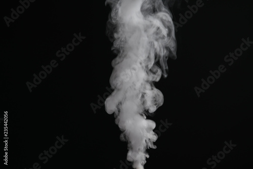 closeup abstract stream of vapor over black background