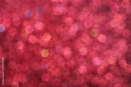Blurred abstract background with red glittering christmas lights.