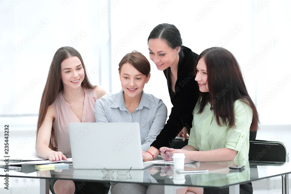 business woman and group of young employees using laptop to work business woman and group of young employees using laptop to work