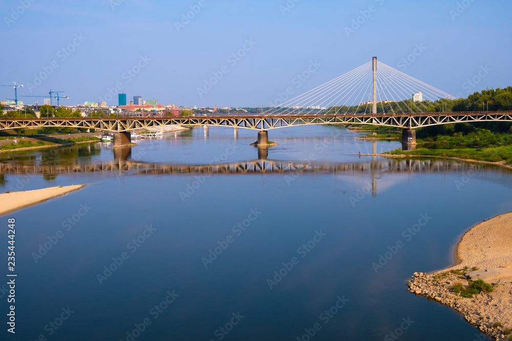 Warsaw, Poland - Panoramic view of the Vistula river with Most Srednicowy railway bridge and northern district of Warsaw