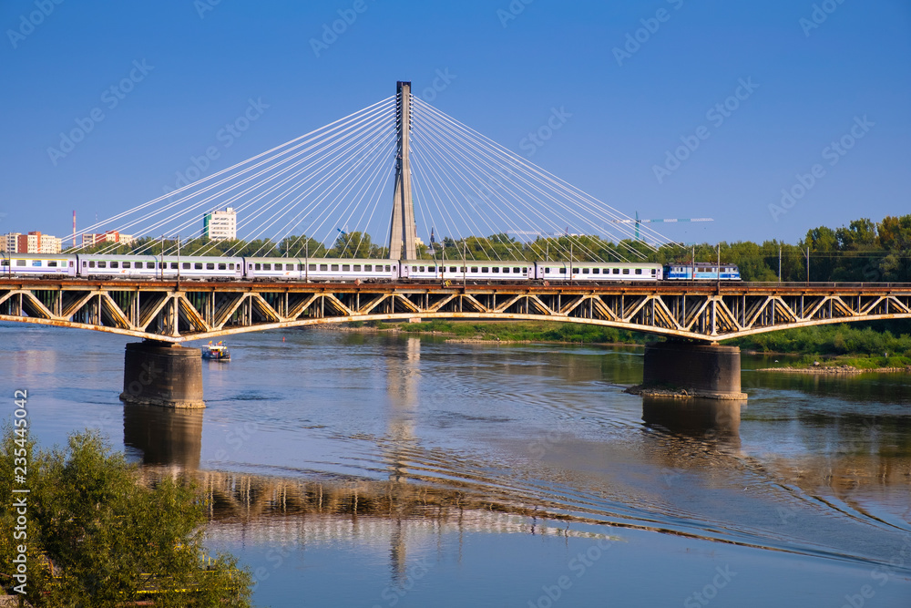 Warsaw, Poland - Panoramic view of the Vistula river with Most Srednicowy railway bridge and northern district of Warsaw