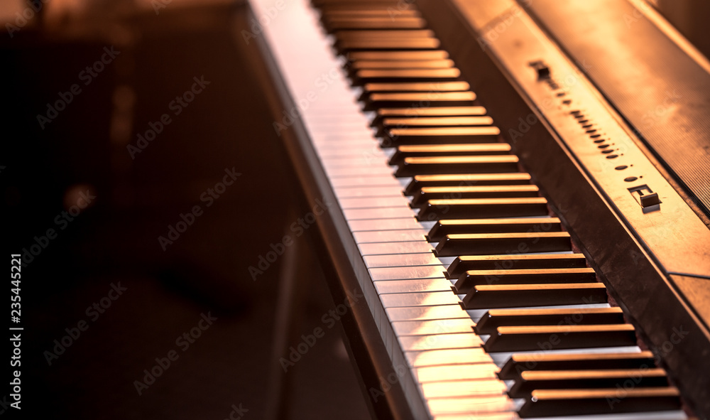 piano keys close-up, on a beautiful colored background piano keys close-up, on a beautiful colored background