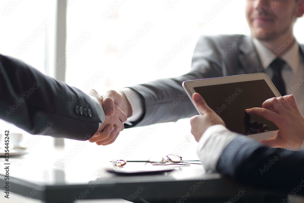 Fototapeta premium close up.confident handshake of business people in the office