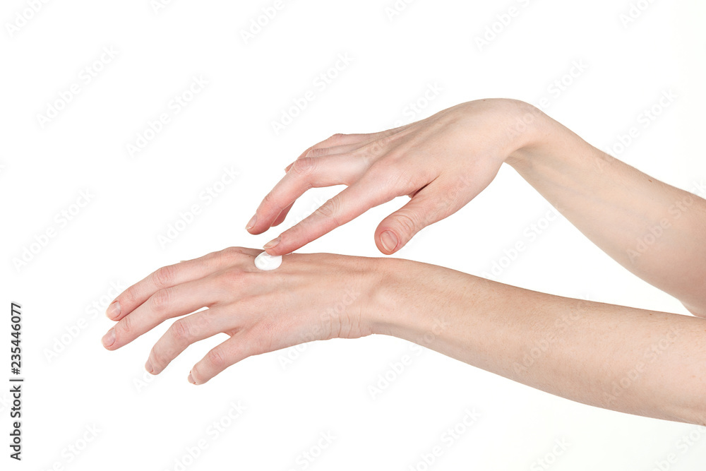 Elegant female hands smear hand cream. Skin care.
Elegant female hands smear hand cream. Skin care.
