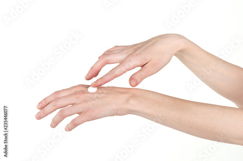 Elegant female hands smear hand cream. Skin care.  