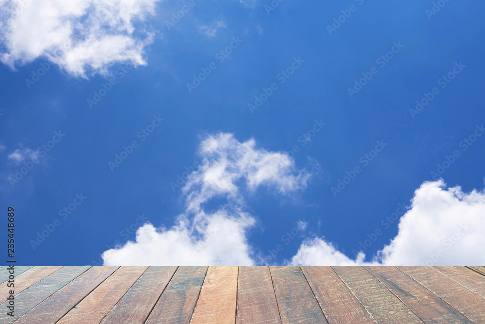 empty wood desk Beautiful blue sky with white clouds for background for background. Blank space for text and images.