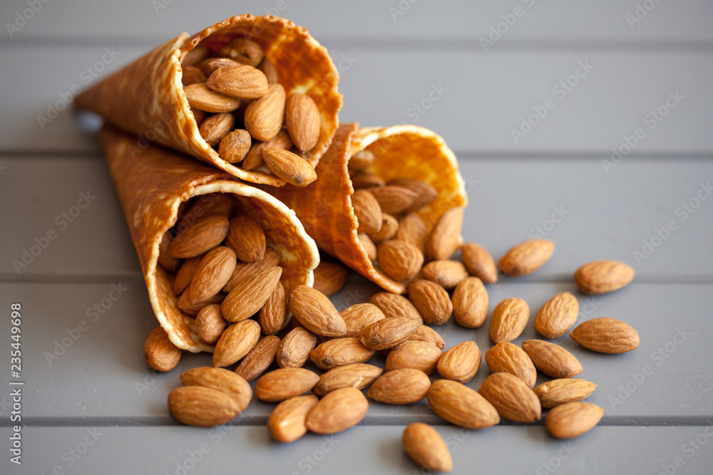 Ice cream cones filled with almond. Healthy lifestyle concept. Ice cream cones filled with almond. Healthy lifestyle concept.
