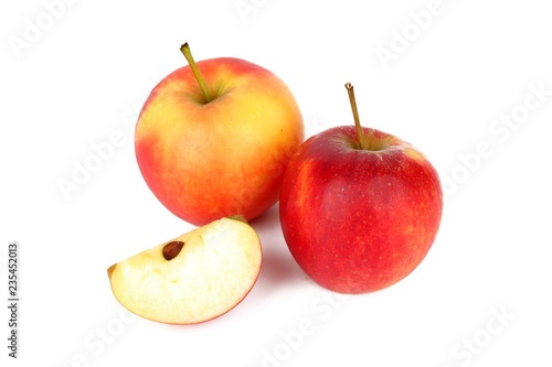 Red ripe apple with a apple piece isolated on white