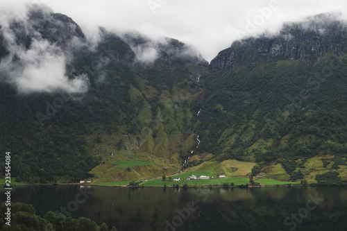 Norwegian village in front of a waterfall