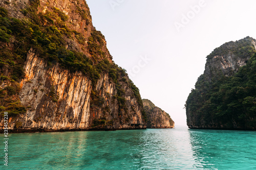 Beautiful emerald-colored lagoon on Paradise Thai Islands. Asian Islands. Thai Phi Phi Islands. Thai wooden boat. Boat in the Bay. Travelling to Asia. Travel to Thailand. Lagoon on the island