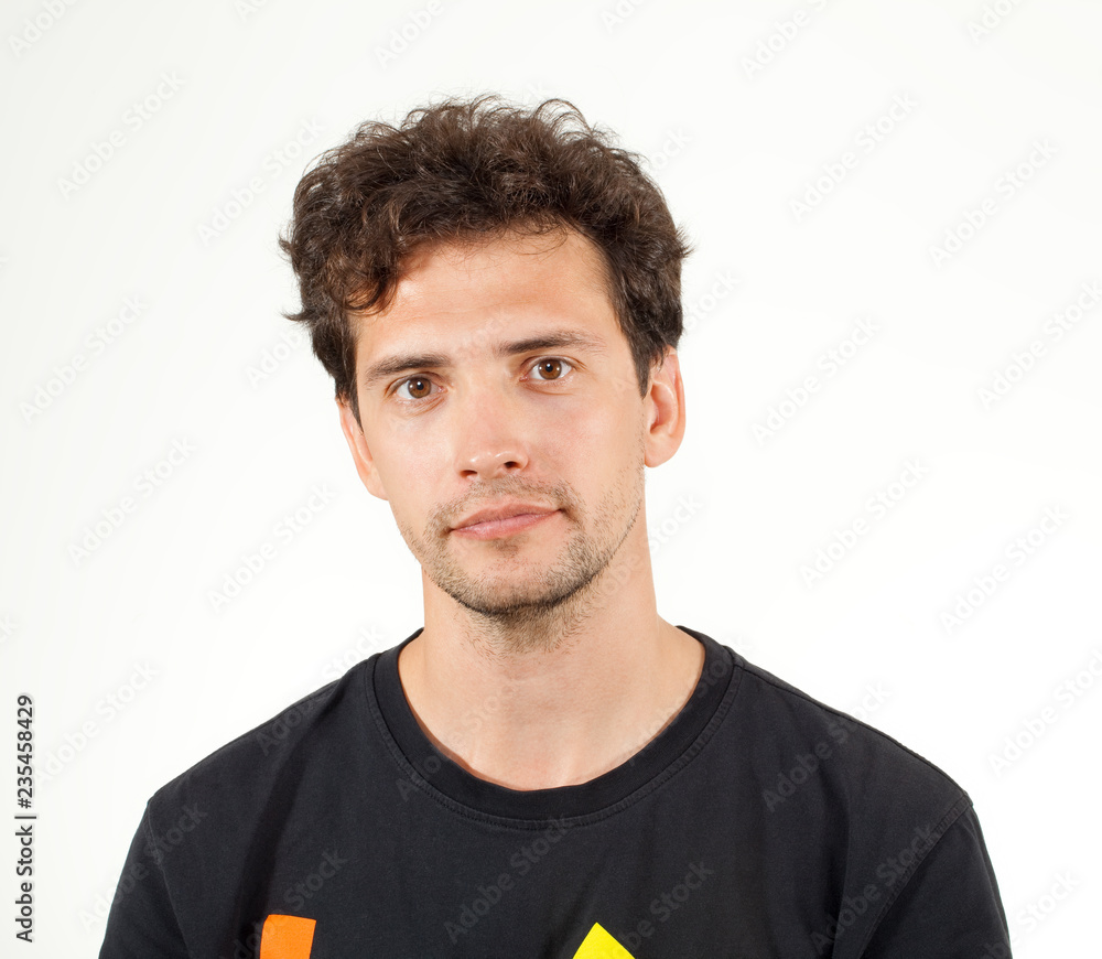 Fototapeta premium Calm guy wearing in T-shirt isolated on white background