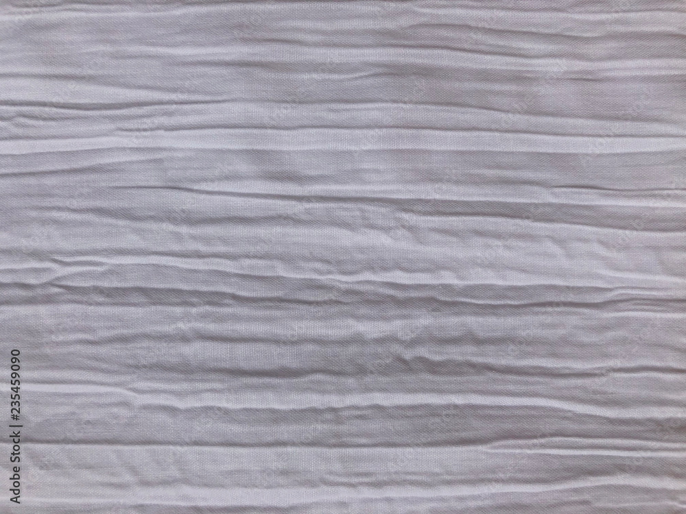 Fototapeta premium White fabric with a crumpled effect and horizontal creases