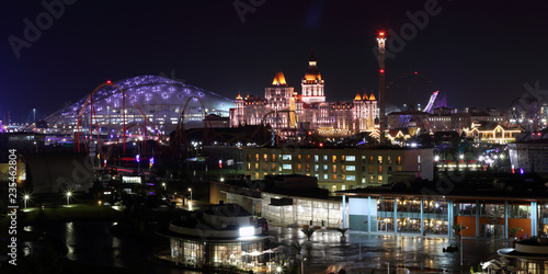 Sport arena and castle-shaped building night panoramic horizontal