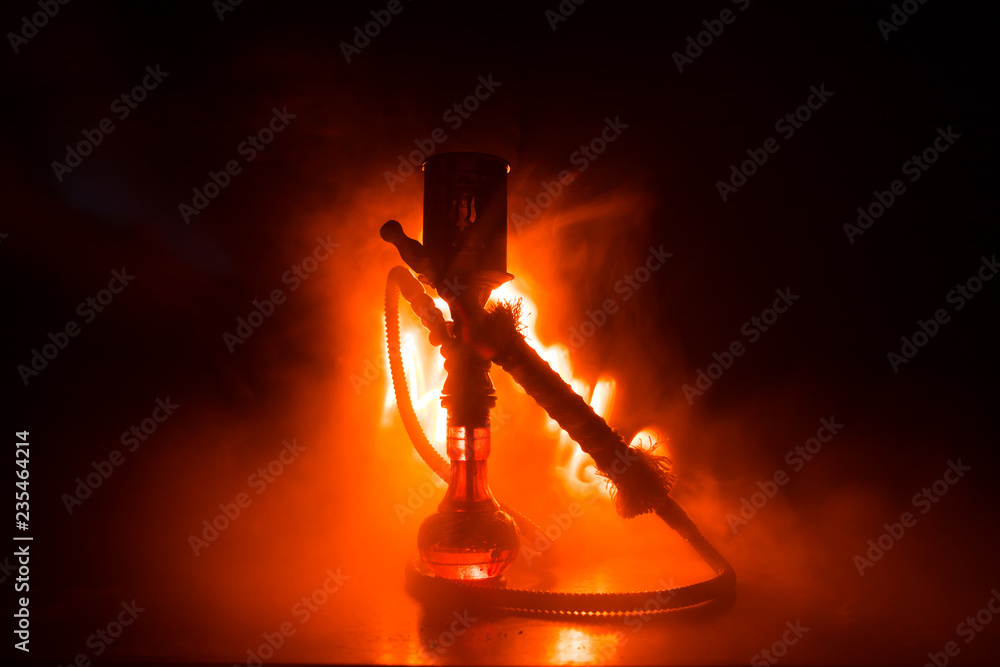 Hookah hot coals on shisha bowl making clouds of steam. Shisha