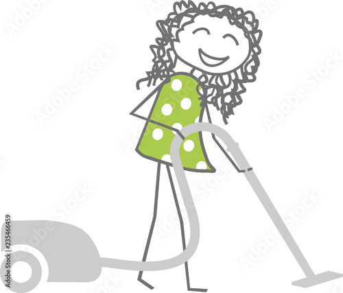 A woman cleans while vacuuming