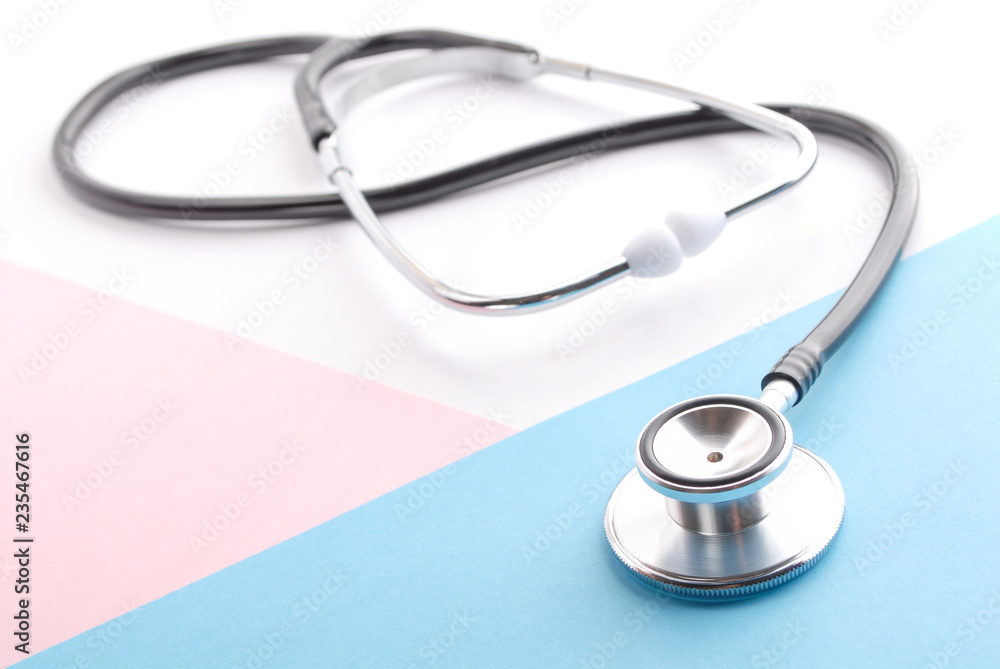 Stethoscope on white. Stethoscope on blue and pink background. Traditional stethoscope. Stethoscope on white. Stethoscope on blue and pink background. Traditional stethoscope.