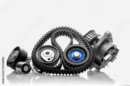 kit of timing belt with rollers on a white background