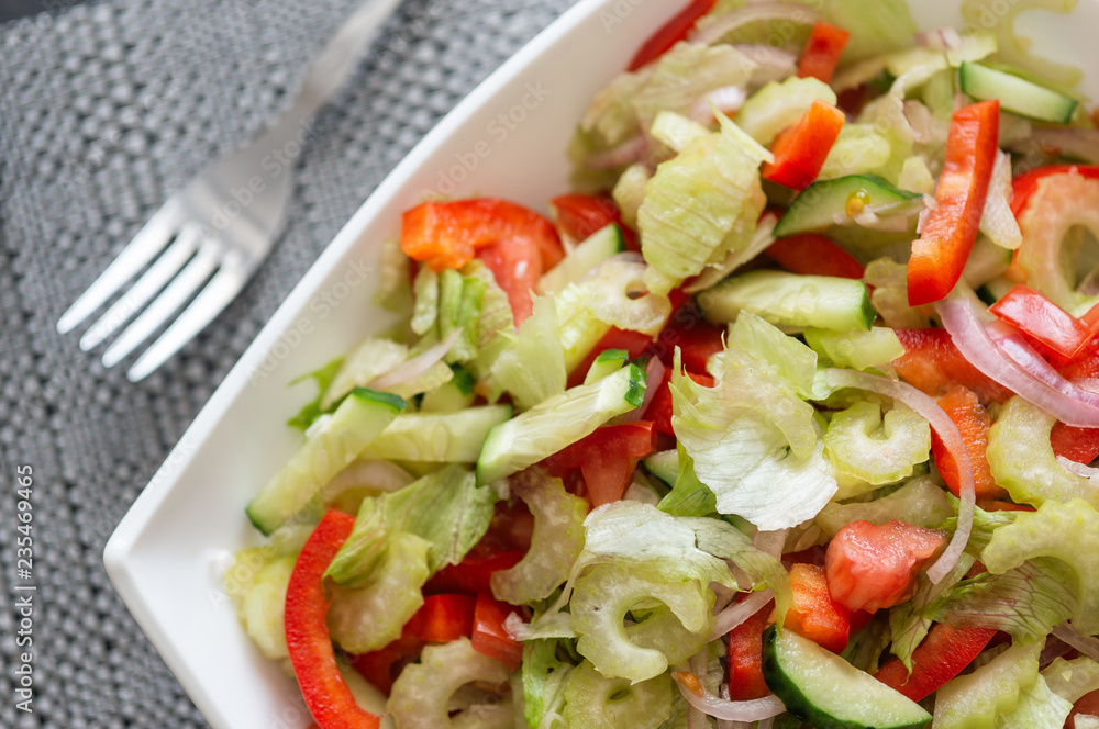 Healthy eating. Fresh vegetable salad in a white plate. Healthy eating. Fresh vegetable salad in a white plate.