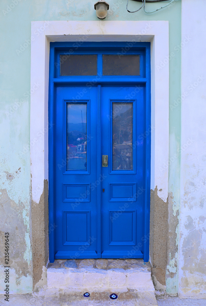Blue Door with Evil eyes charms in Kastellorizo,Greece