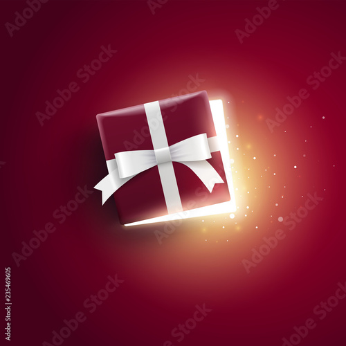 Half open gift box with magical lights.