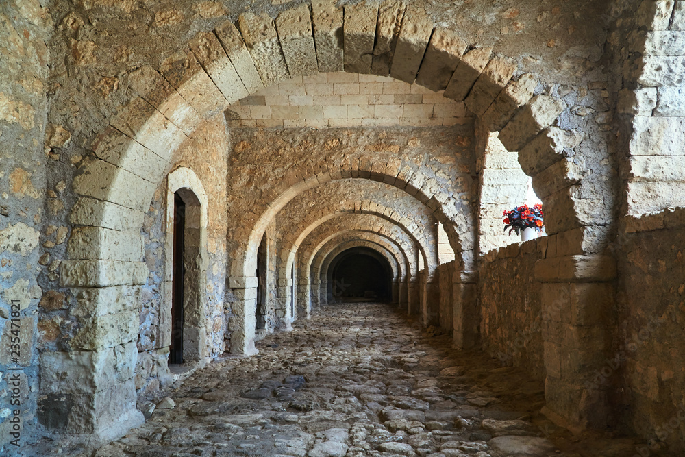 a stone cloister of a historic monastery Orthodox Moni Arcadia on the island of Crete.